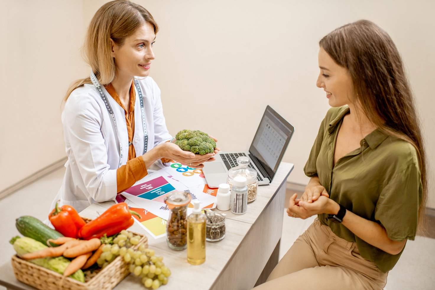 Nutritionist with Female Client at the Office